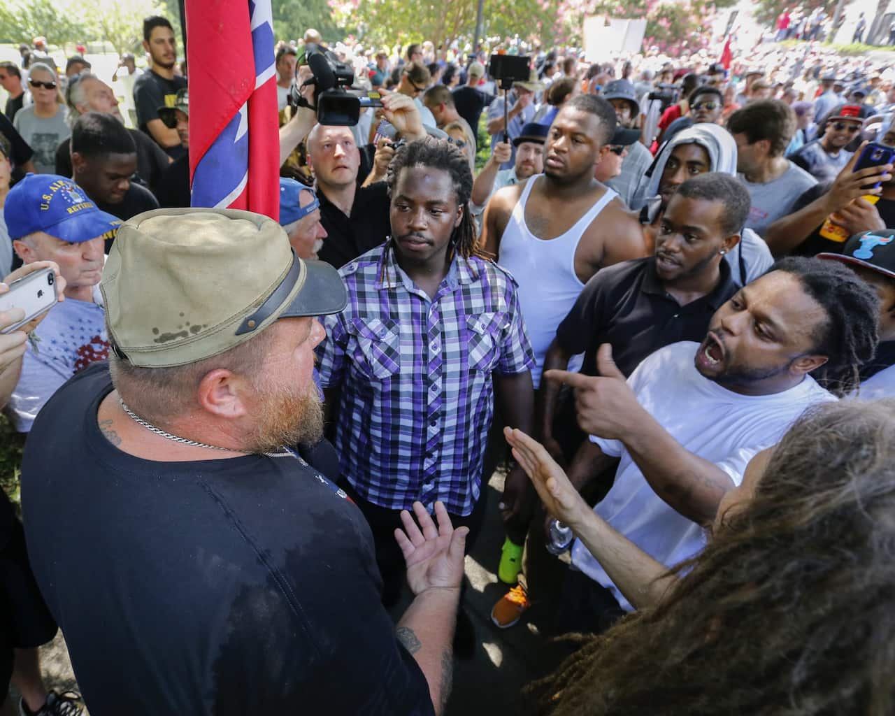 Opposing sides clash during New Black Panther Party and the Loyal White Knights of the Ku Klux Klan rallies on the grounds of the South Carolina Capitol in Columbia