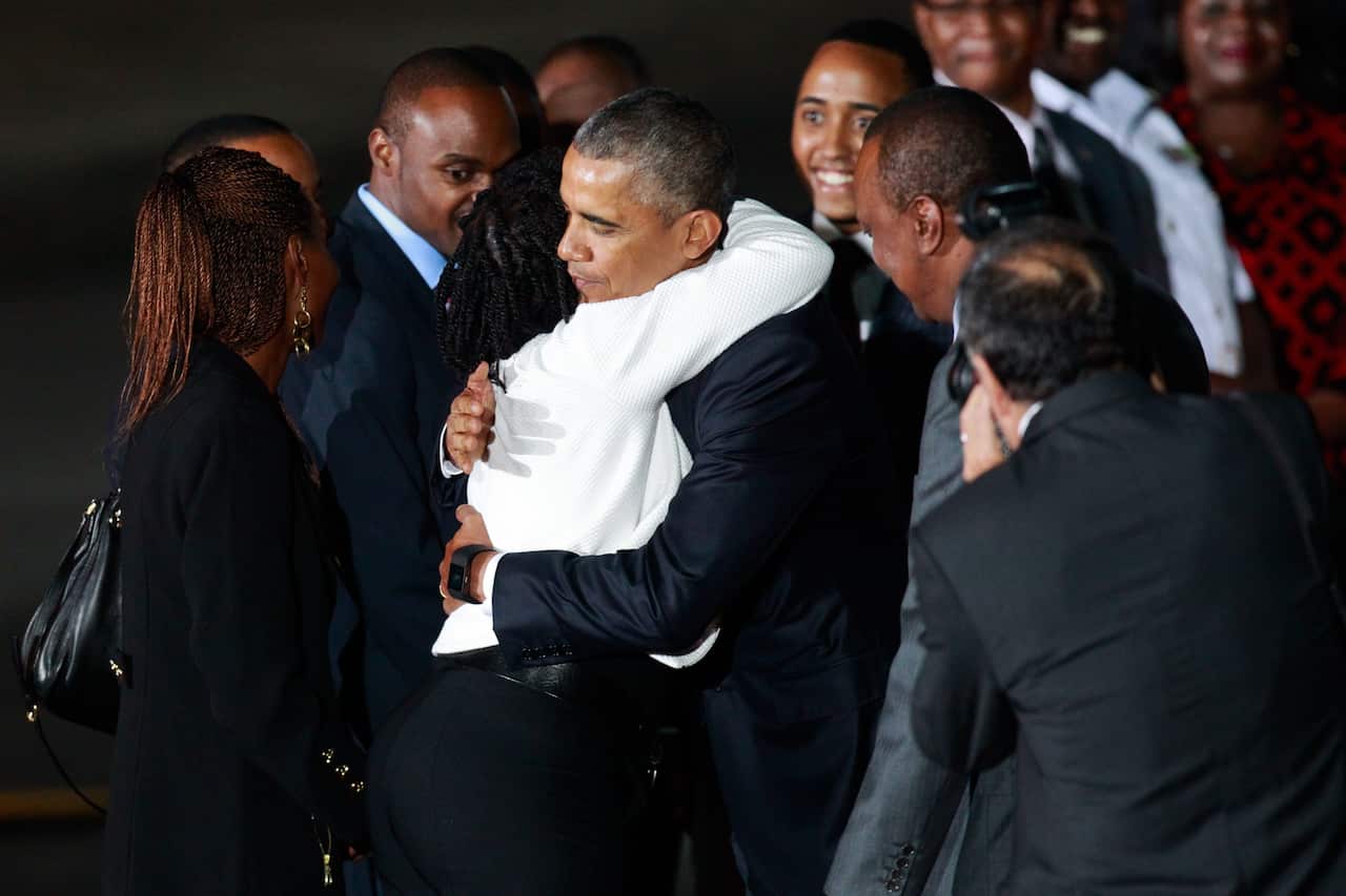 US President Barack Obama hugs from his half-sister Auma Obama