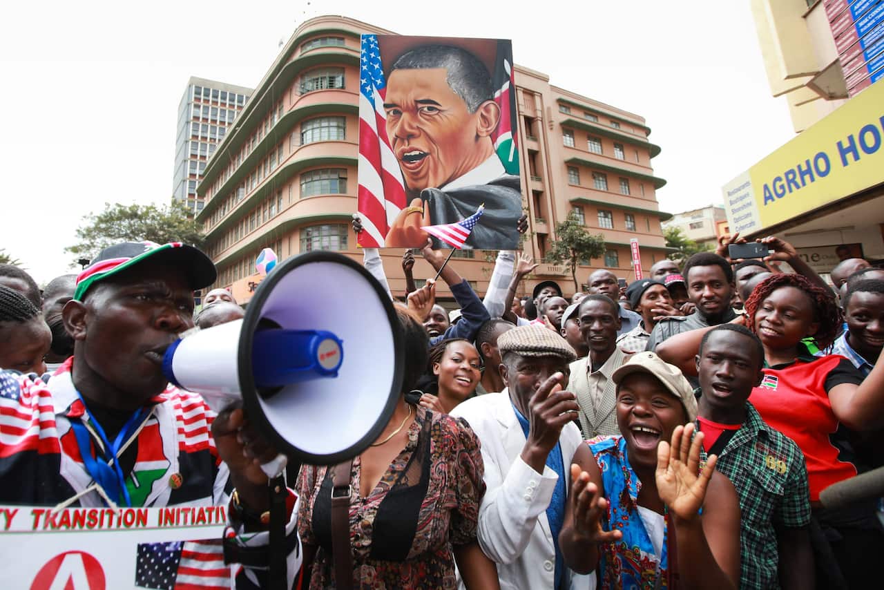 Kenyan people gather to witness US President Barrack Obama