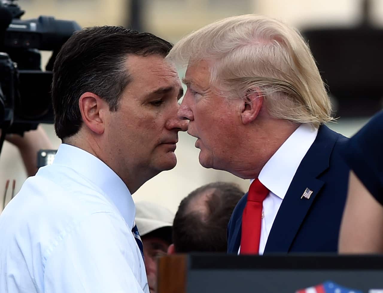 Republican Presidential candidate Donald Trump speaks with fellow Republican presidential candidate Senator Ted Cruz