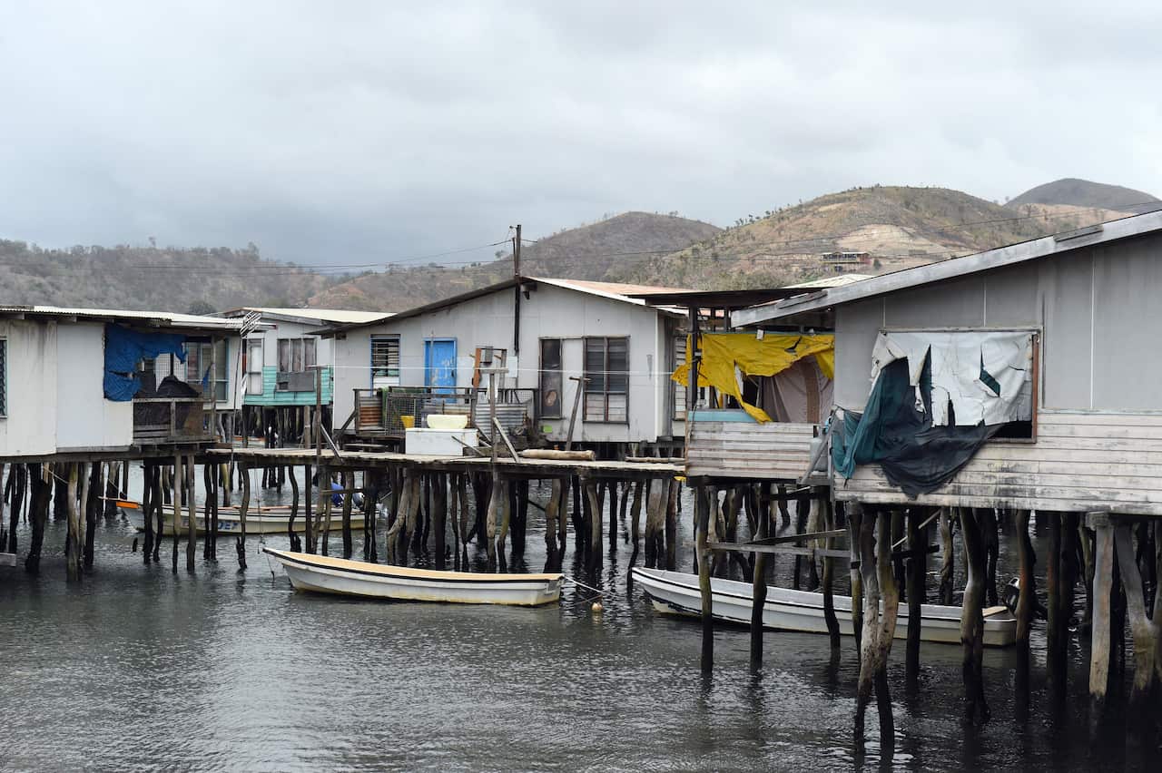 Boats are moored outside homes in the stilted village of Hanuabada near Port Moresby, Papua New Guinea.