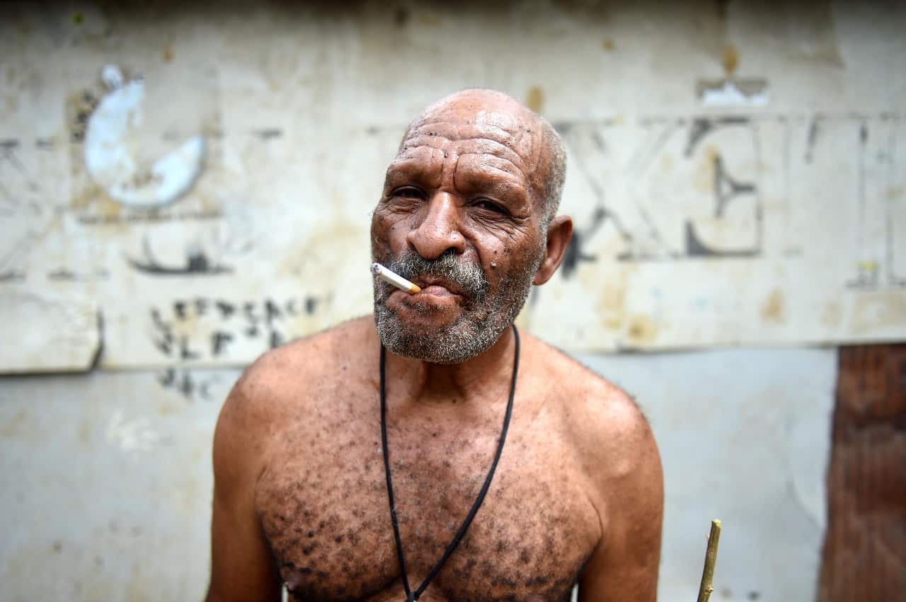 A man smokes in Papua New Guinea.