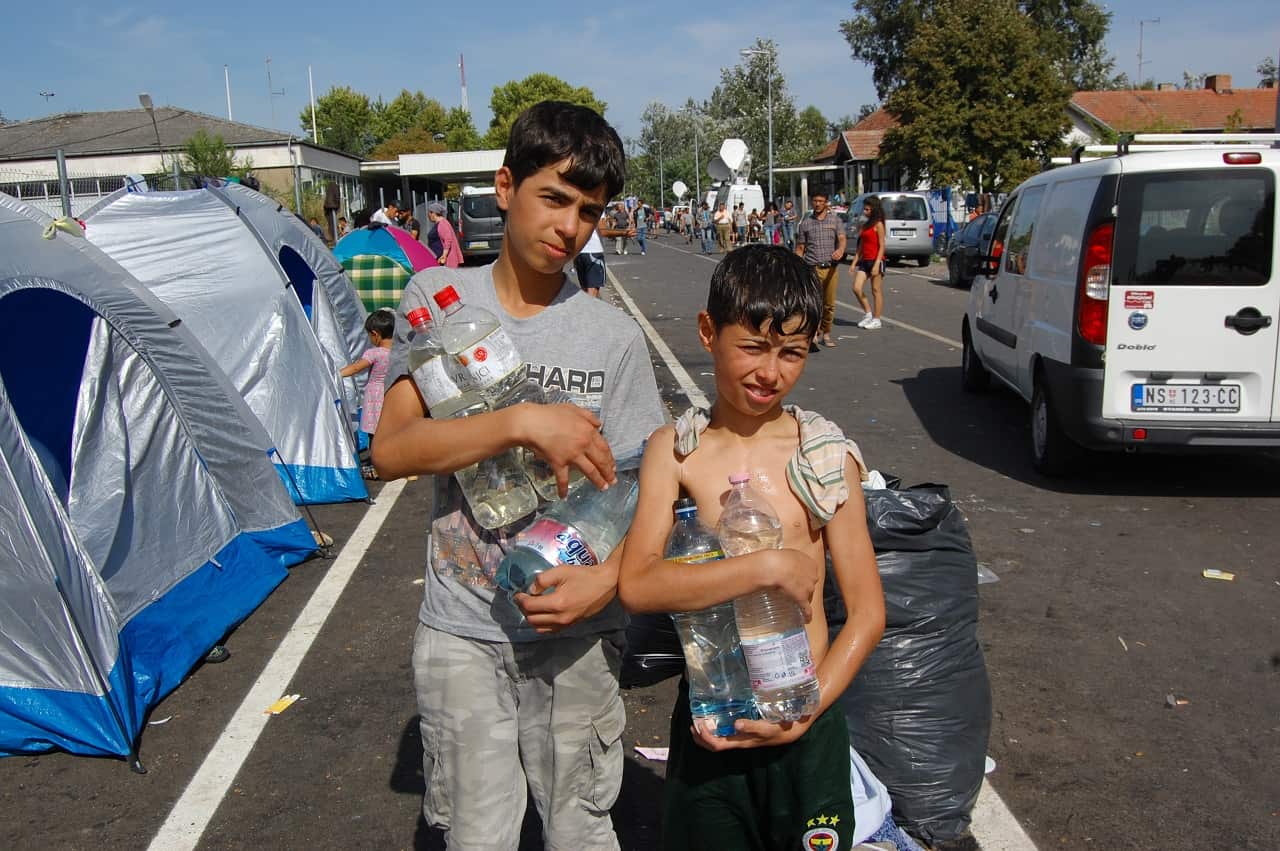 Two young migrant boys near the Serbia-Hungary border in Horgo, Serbia on September 17, 2015.