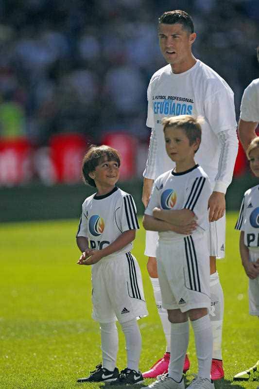 Zaid, left, looks at Real Madrid's Cristiano Ronaldo ahead a Spanish La Liga soccer match between Real Madrid and Granada