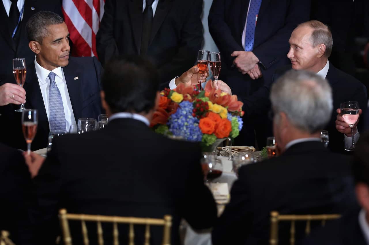 US President Barack Obama (L) and Russian President Vladimir Putin (R) at the start of a luncheon for world leaders during the 70th session of the United Nations General Assembly at United Nations headquarters in New York, New York, USA, 28 September 2015
