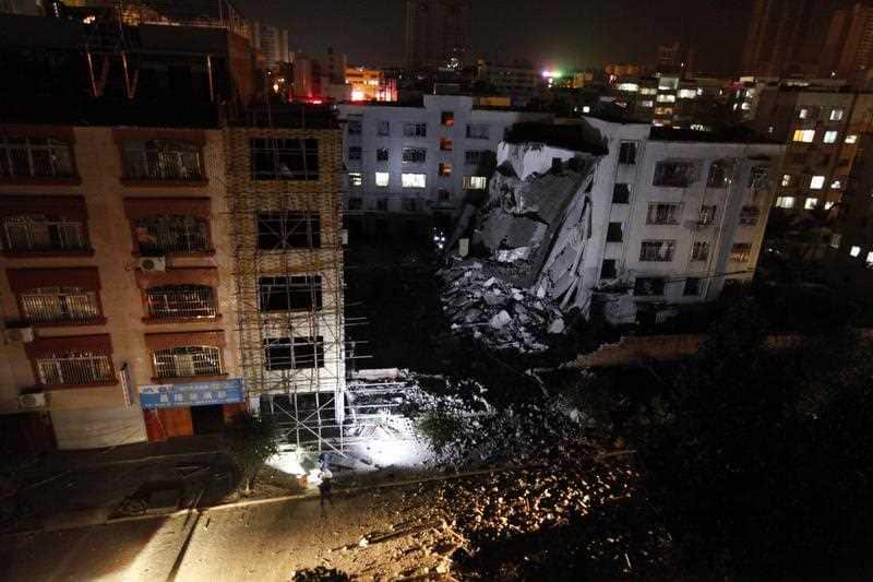 View of a devastated building after blasts were triggered by explosive devices hidden in express delivery packages in Liucheng
