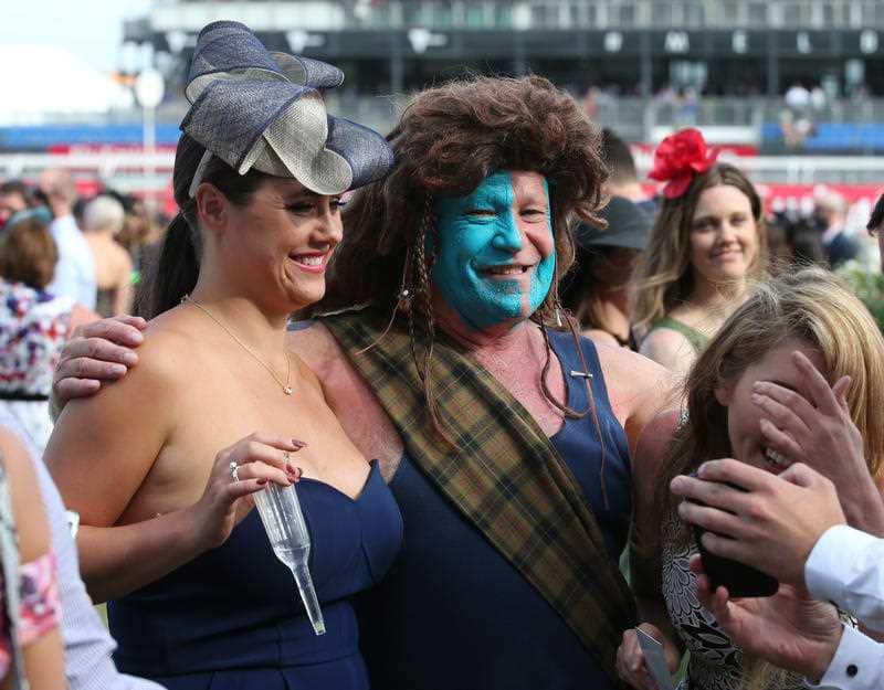 Punters enjoy the end of the day at Melbourne Cup Day at Flemington Racecourse in Melbourne