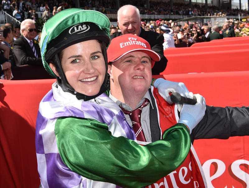 Michelle (left) and Steven Payne celebrate after Michelle rode Prince of Penzance to victory in the Melbourne Cup at Flemington Racecourse in Melbourne, Tuesday, Nov. 3, 2015. (AAP Image/Julian Smith)