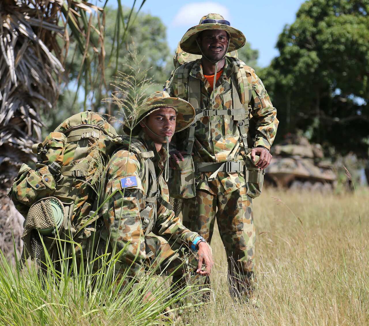 Work experience students Lerio Getawan (left) and Richard David from St Teresa's College Abergowrie, join an Army field training exercise in Ingham, North Queensland. *** Local Caption *** Staff cadets from Royal Military College - Duntroon conducted fiel