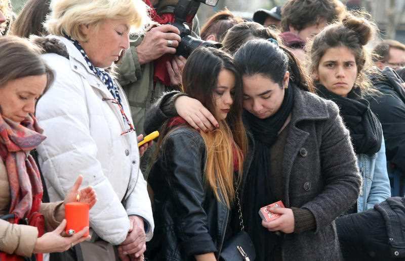 Thousands turn out across Paris observe a moment of silence for the victims of Paris terror attacks at the Place de la Republique square in Paris, France on Nov. 15, 2015. 