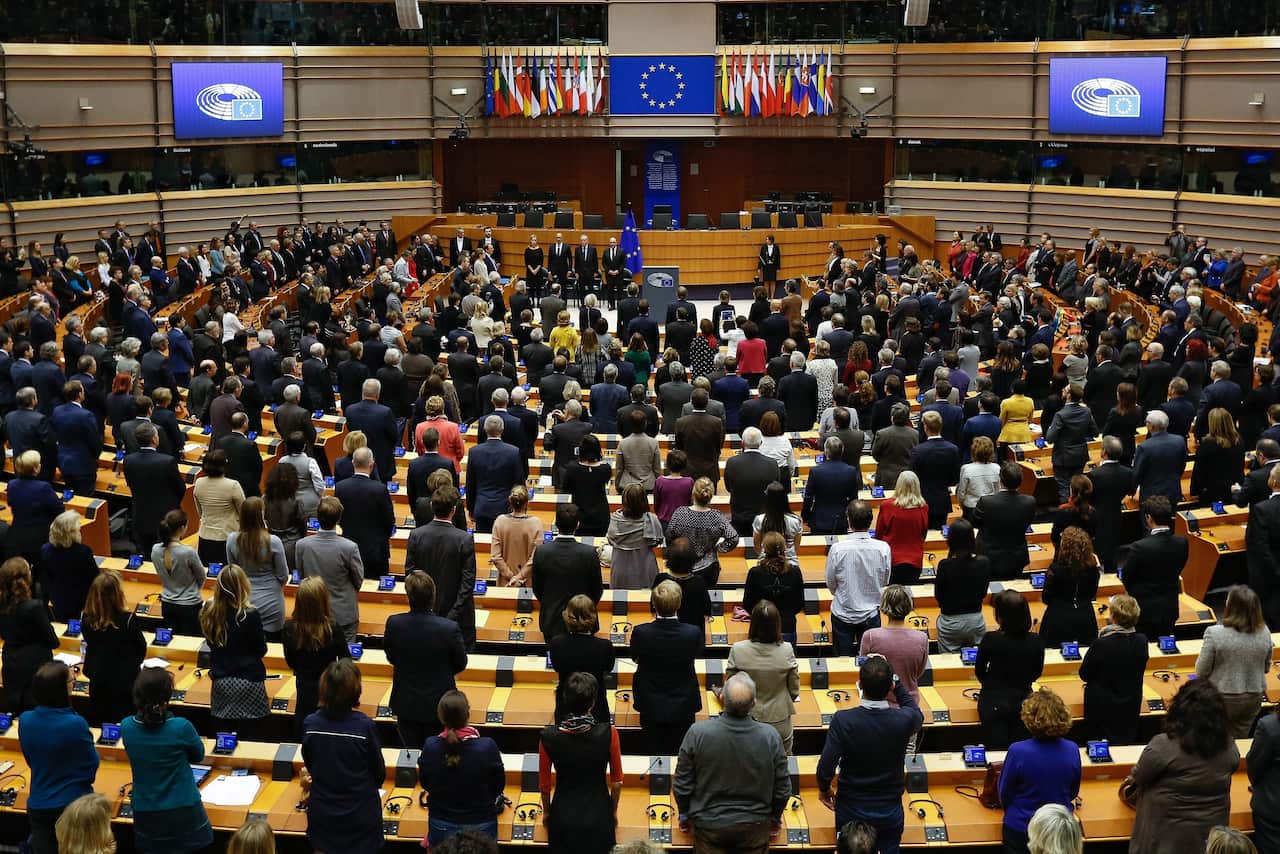 Members of the European Parliament observe a minute of silence for the 13 November Paris attacks victims at the European Parliament in Brussels