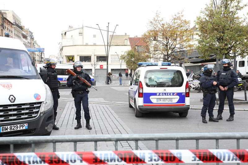 Policemen guard the special operation zone while French police fire nearly 5,000 rounds during a ferocious firefight north of Paris with a fourth terrorist cell that was “ready to strike”.