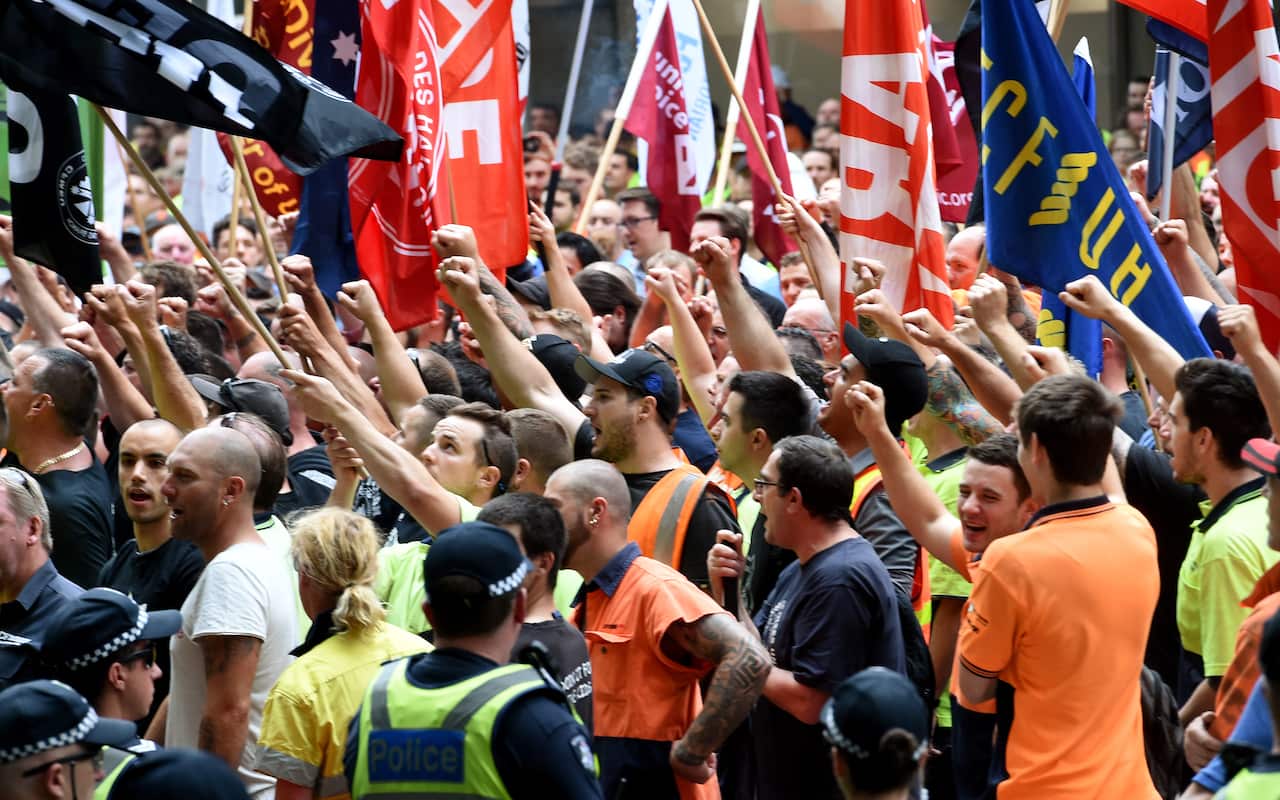 Union members hold a protest outside of the Melbourne Magistrates Court.