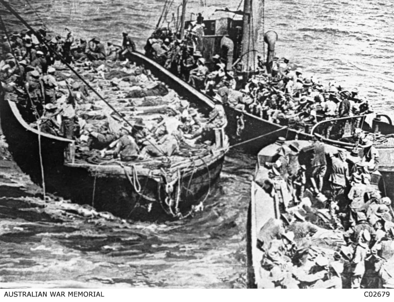 A supplied image of wounded soldiers are evacuated from Anzac Cove on barges. 