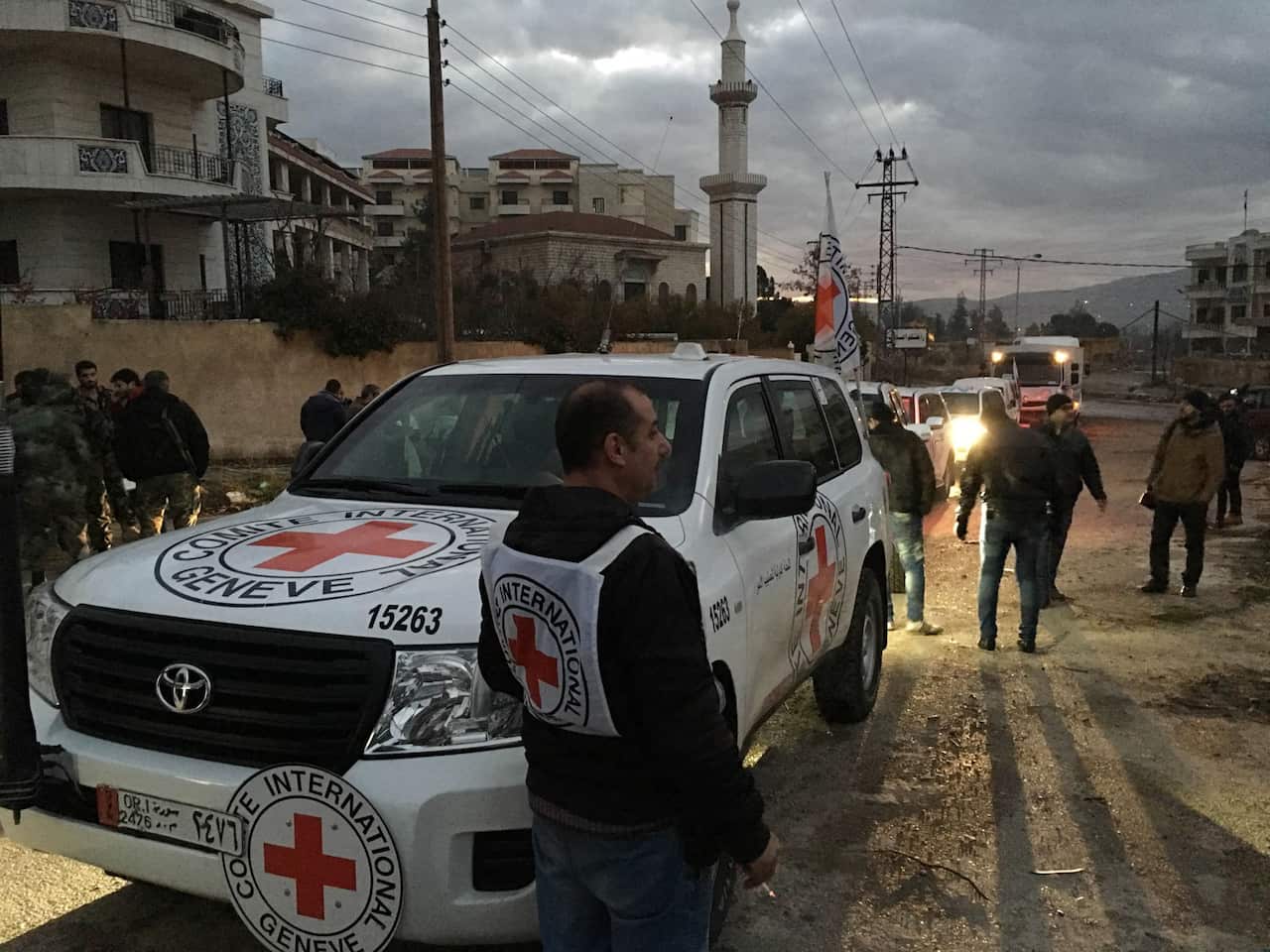 This picture provided by The International Committee of the Red Cross (ICRC), working alongside the Syrian Arab Red Crescent (SARC) and the United Nations (UN), shows a convoy containing food, medical items, blankets and other materials being delivered to