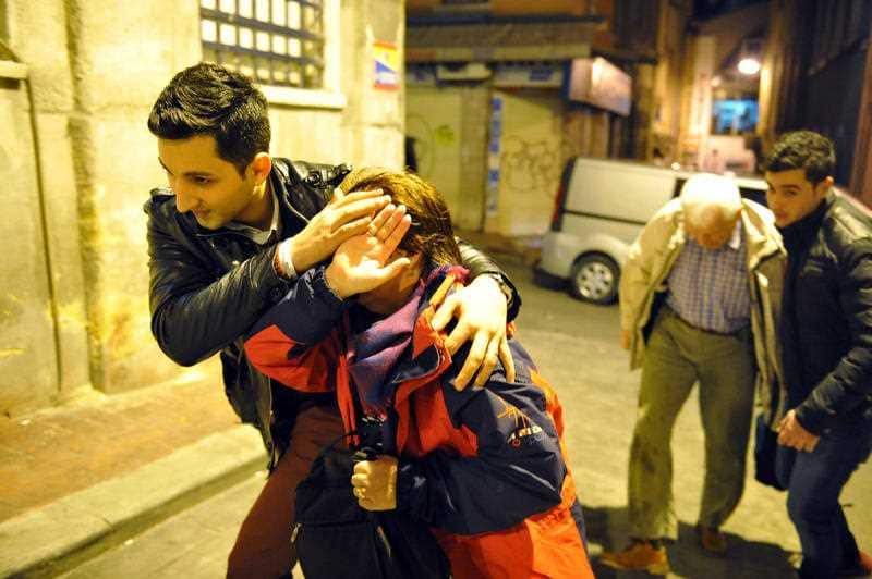 People believed to be German tourists that were targeted at an explosion in the historic Sultanahmet district are escorted back to their hotel in Istanbul, Tuesday, Jan. 12, 2016.