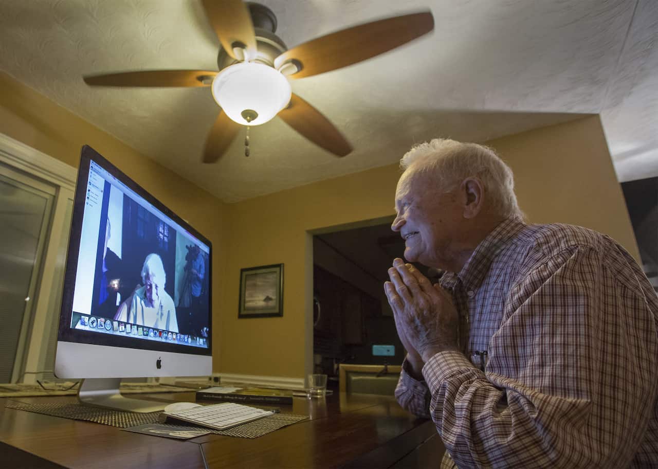 Norwood Thomas, 93, talks with Joyce Morris via Skype from his home in Virginia Beach.