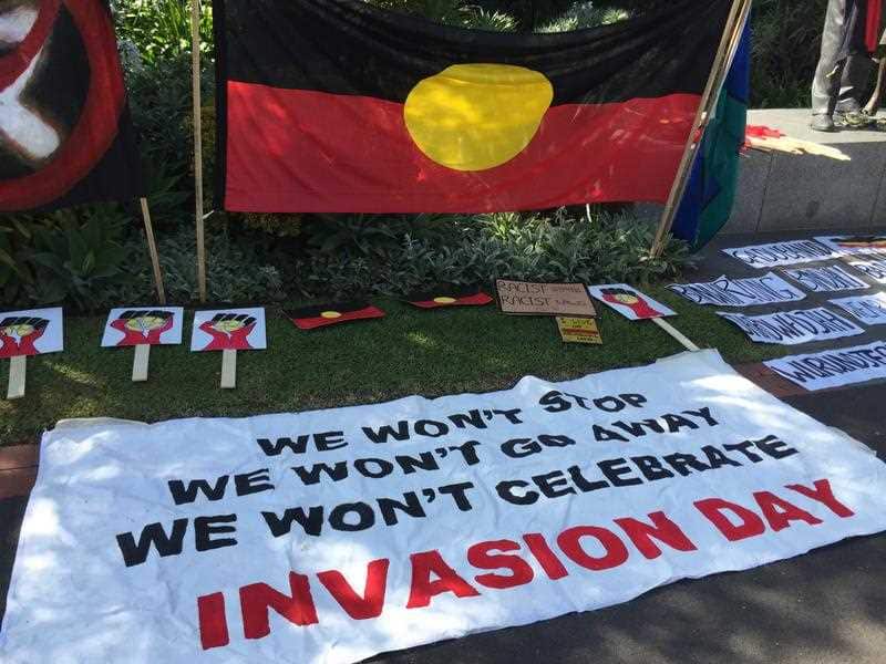 A sign at  an Invasion Day protest in Melbourne.