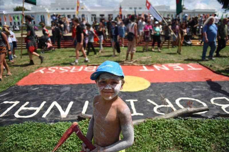 A child is seen during an Aboriginal protest at the Tent Embassy on the lawns of Old Parliament House in Canberra.
