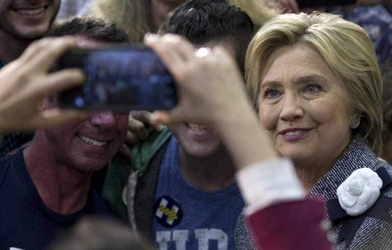 Democratic presidential candidate Hillary Clinton greets supporters and takes photos during a campaign event at the Grady Cole Center in Charlotte, N.C.