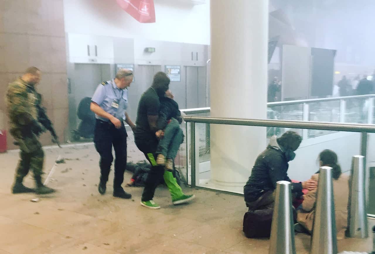 This photo provided by Georgian Public Broadcaster and photographed by Ketevan Kardava, shows the scene in Brussels Airport after the explosion.