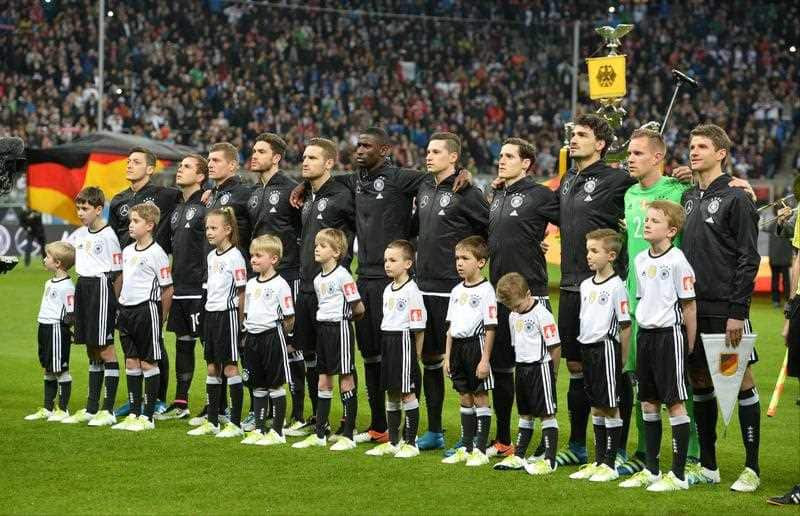The German team sing the national anthem during a friendly soccer match between Germany and Italy at the Allianz Arena in Munich, southern Germany.