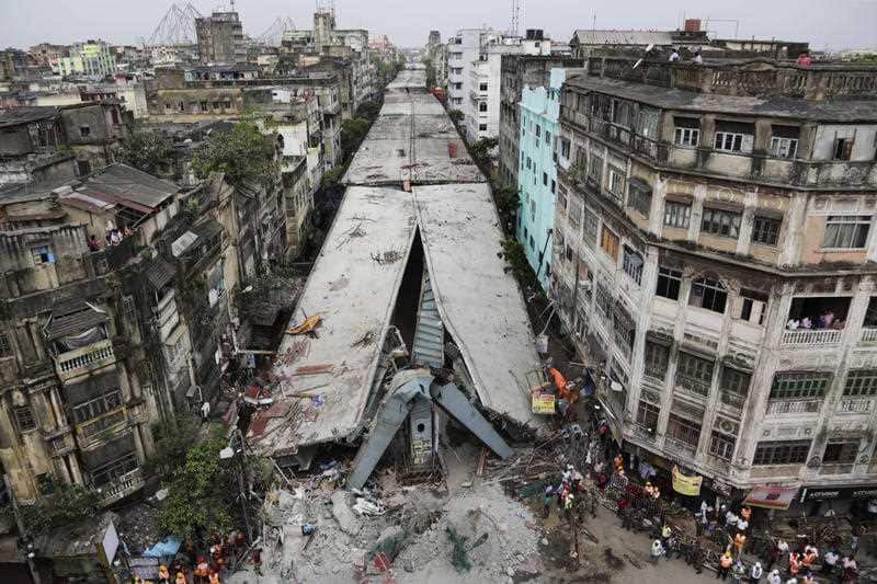 A partially collapsed overpass in Kolkata, India. The overpass spanned nearly the width of the street and was designed to ease traffic.
