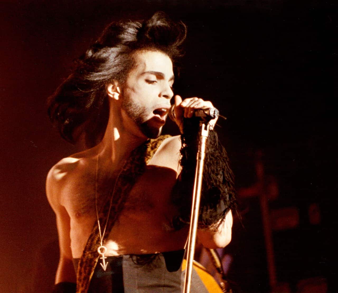 In this May 2, 1990 photo Prince performs a benefit concert for the family of Charles (Big Chick) Huntsberry in Minneapolis.