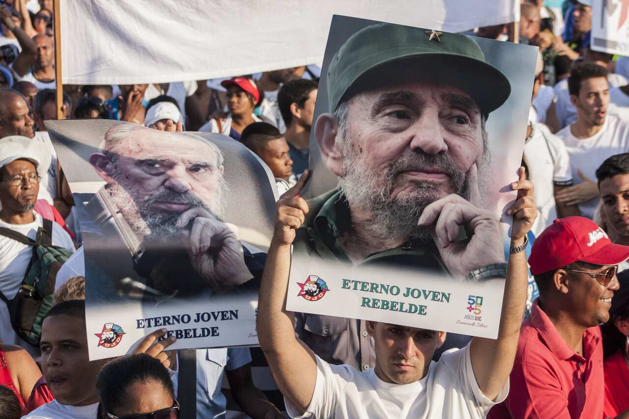 CUBA, Havana: People display pictures of Cuban former president Fidel Castro during the May Day parade in Havana, on May 1, 2016.  (AAP Image/NEWZULU/Reno Massola).