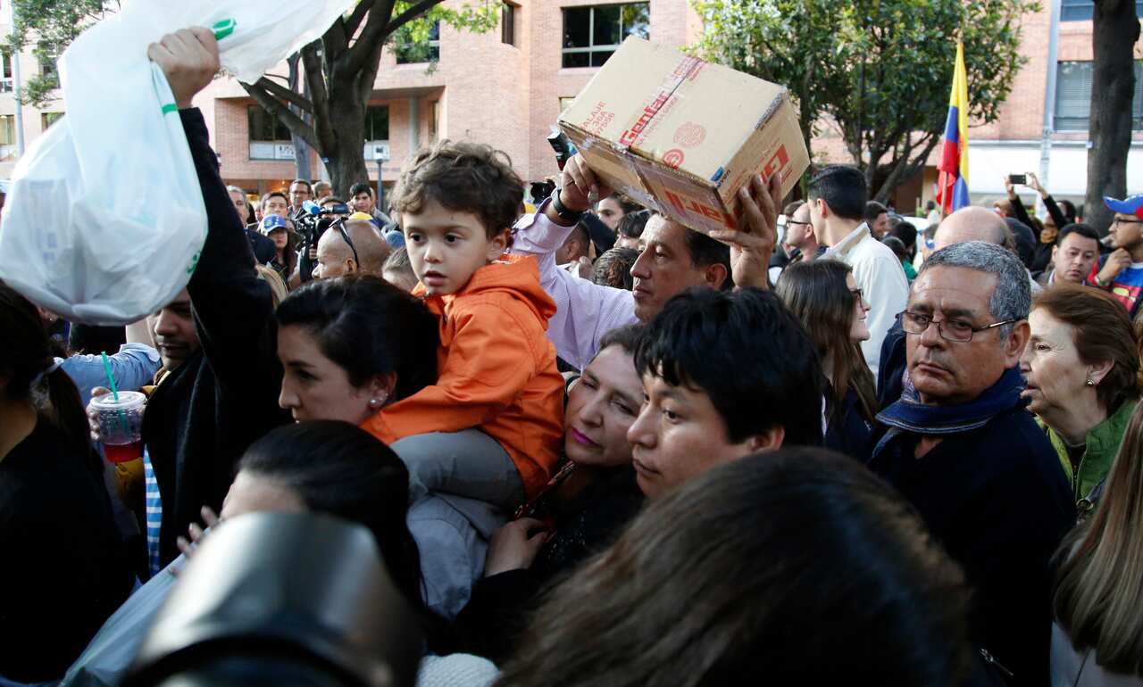 People line up to donate medical supplies and diapers during the "Rescue Venezuela" campaign