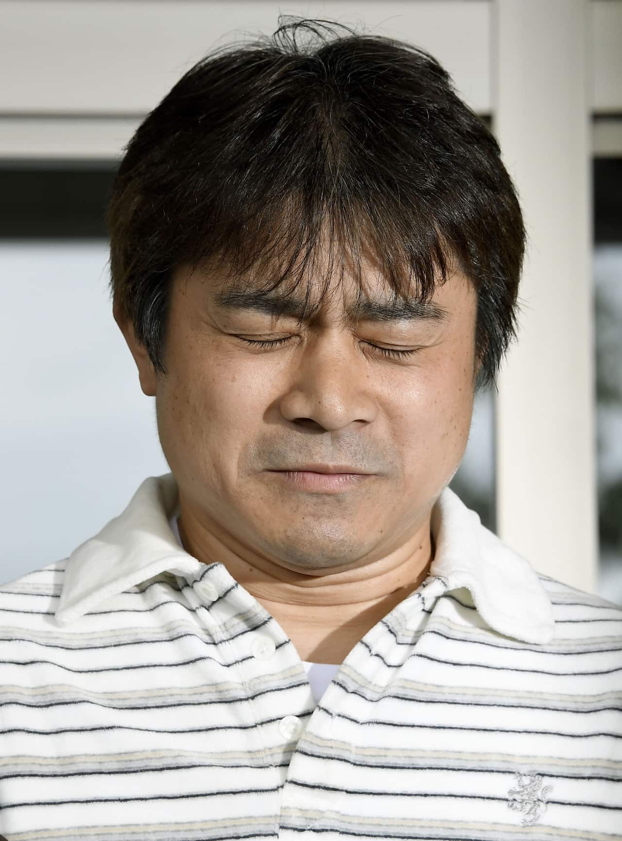 Takayuki Tanooka, father of the 7-year-old Japanese boy who went missing nearly a week ago. (AP)