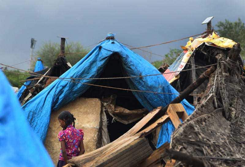 Solar panels installed on top of the shanties and connected to lithium battery run solar lights, provided by Pollinate Energy, a non-government organization.
