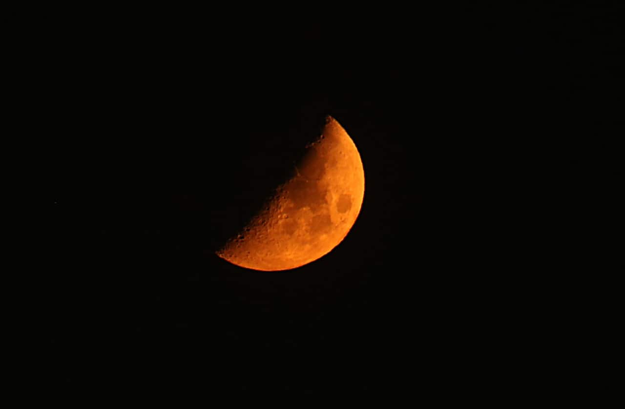 A crescent moon hangs above Gaza during the seventh day of the holy month of Ramadan, Gaza Strip, 12 June 2016.  EPA/MOHAMMED SABER
