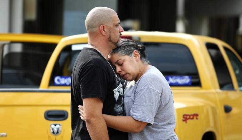 Ray Rivera, a DJ at Pulse Orlando nightclub, is consoled by a friend, outside of the Orlando Police Department after the massacre