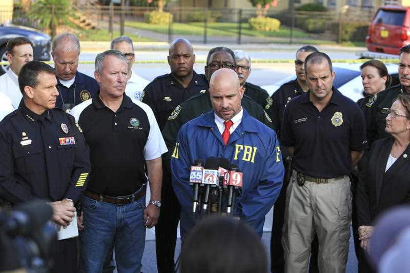FBI assistant special agent in charge Ron Hopper (center) speaks during a press conference regarding the Orlando Pulse nightclub shooting.