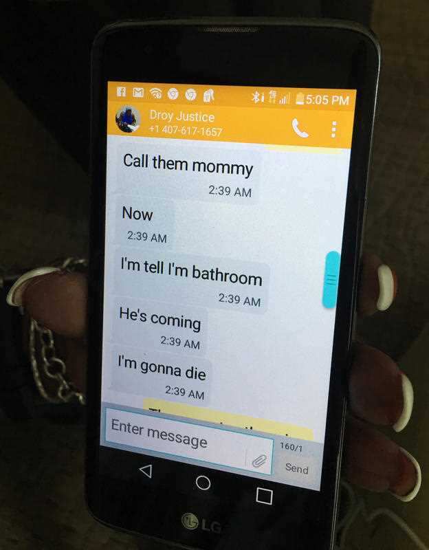 Mina Justice shows a text she received from her son Eddie Justice at Pulse nightclub during a fatal shooting in Orlando, Florida.
