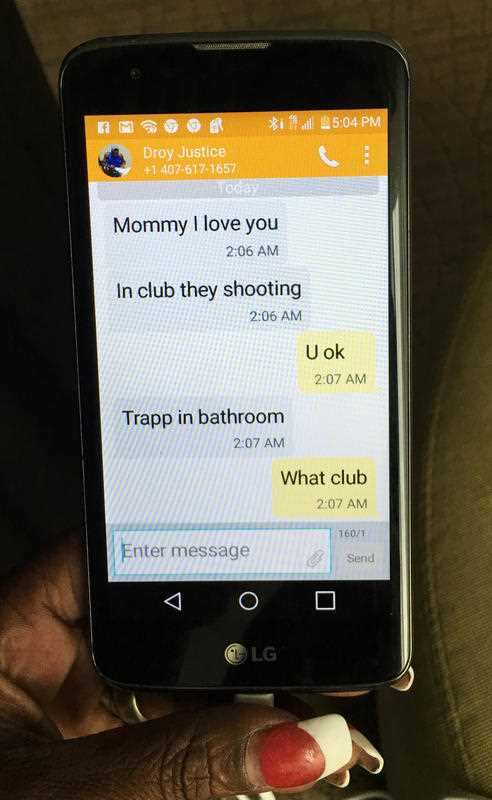 Mina Justice shows a text she received from her son Eddie Justice at Pulse nightclub during a fatal shooting in Orlando, Florida.