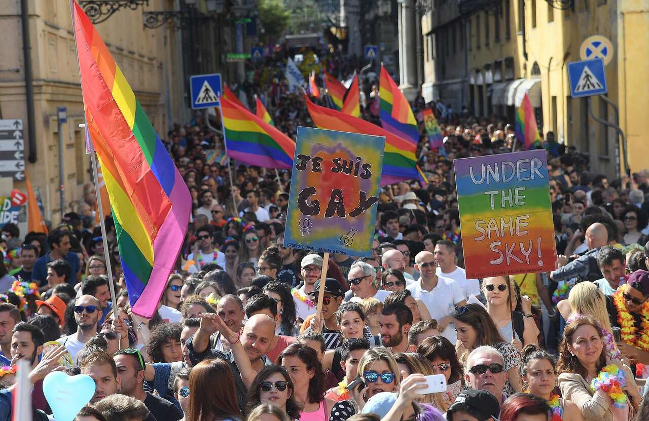 People take part in a gay pride parade led by the LGBT community, in Genoa, Italy