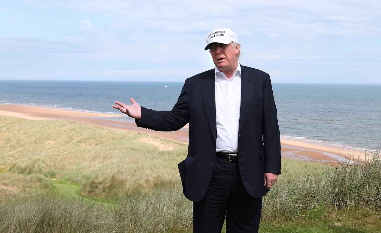 Donald Trumpon the 14th tee while on a tour of Trump International Golf Links at Balmedi, Scotland.