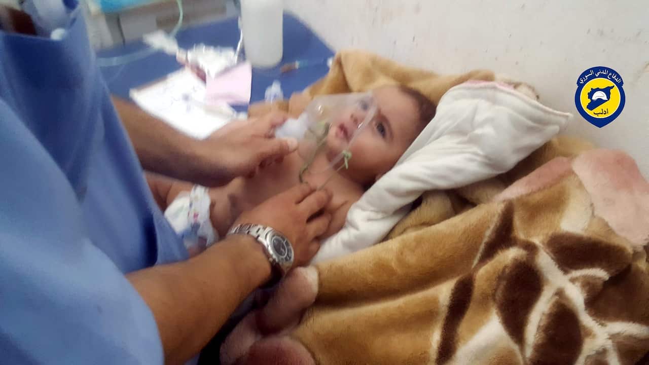 A rescue worker giving treatment to a baby who was allegedly affected by a chlorine gas canister in Saraqeb, Idlib, Northern Syria