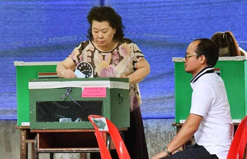 A woman casts her vote at a polling station in Thai capital Bangkok Kyodo
