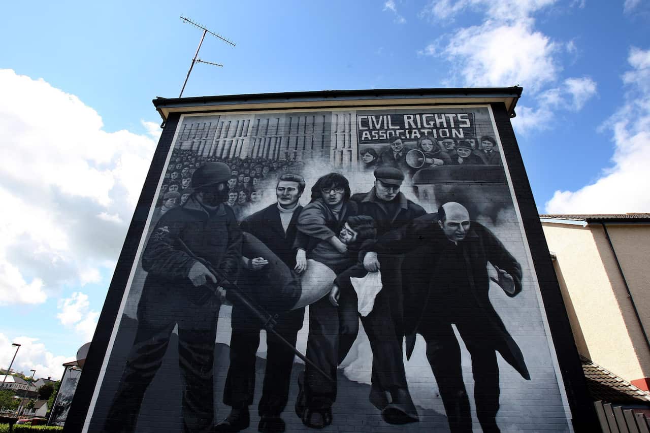 Edward Daly waving a white handkerchief as he led Jackie Duddy away from danger on Bloody Sunday. 