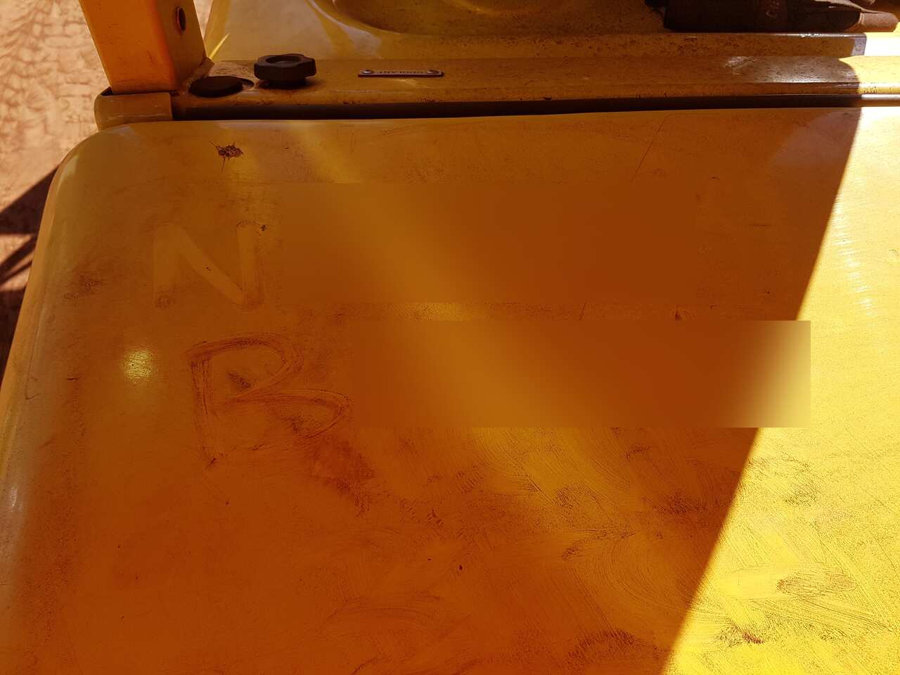 Ms Cant claims this offensive message was written in dust on the back of a forklift.