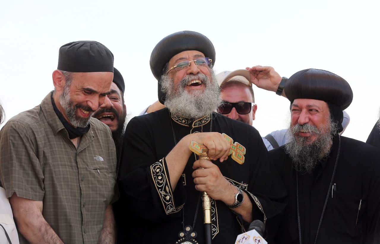 Pope Tawadros II shares a laugh with Jordanian Prince Ghazi Bin Mohamed (L) during his visit to the Baptism Site at Jordan river, west of Amman, Jordan, 2016.