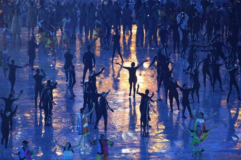 Artists dance in the rain at the end of the opening ceremony of the Rio 2016 Paralympic Games at Maracana Stadium in Rio de Janeiro, Brazil