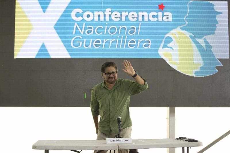 Ivan Marquez waves at a press conference in 2016