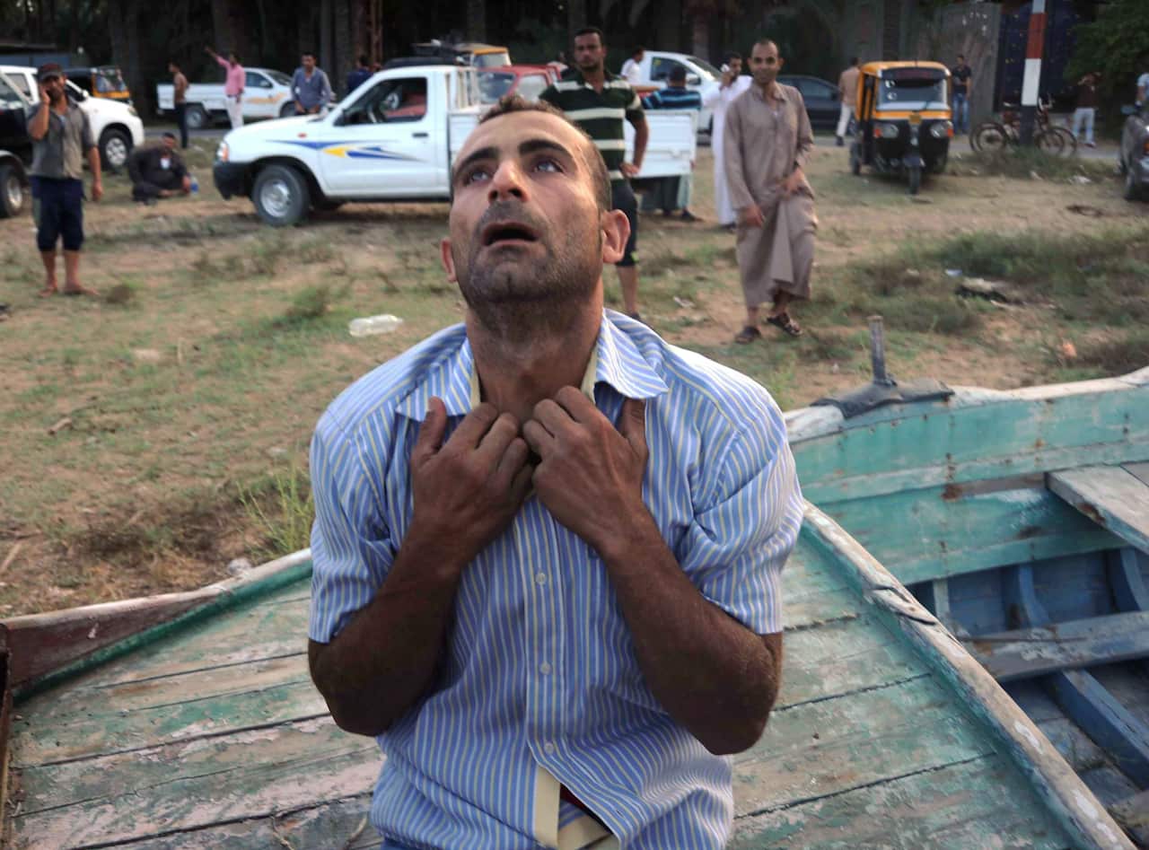 A relative of a missing person on the capsized boat reacts as he waits for rescue workers, the port city of Rosetta, some 250km north of Cairo, Egypt