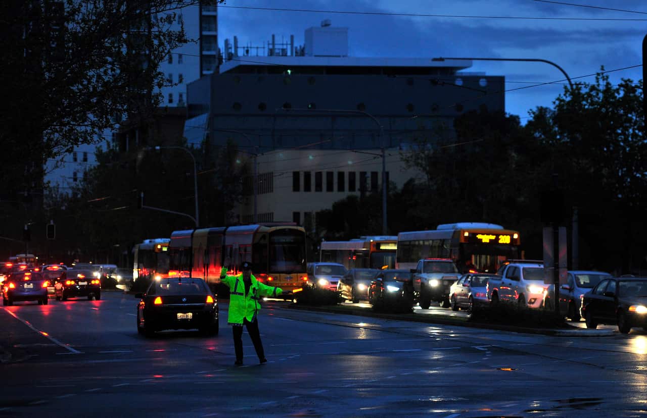 Police direct traffic around the CBD in Adelaide after the power network stops working. Wednesday September, 28, 2016.