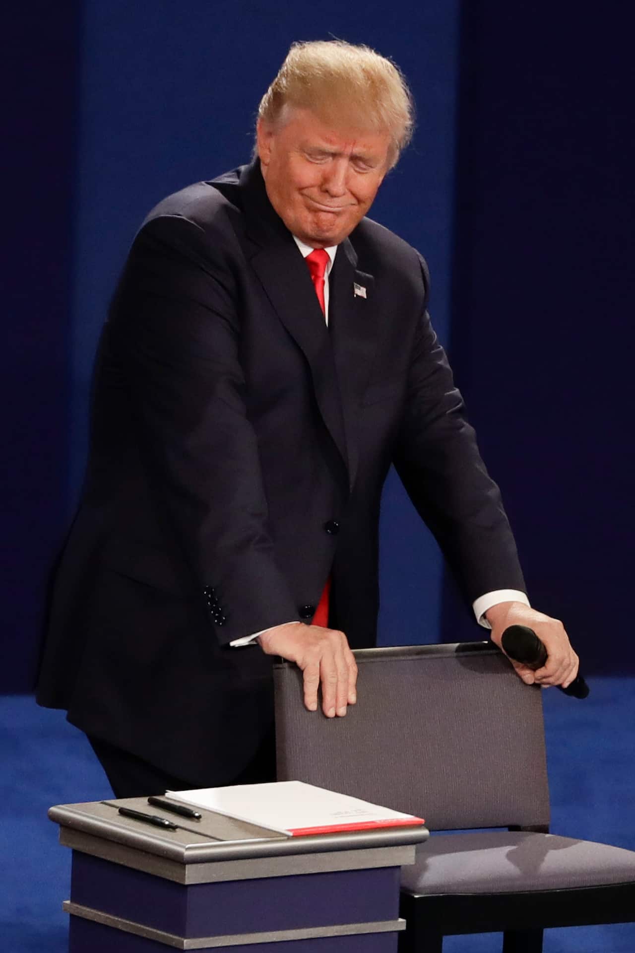 Republican presidential nominee Donald Trump reacts to Democratic presidential nominee Hillary Clinton's answer to a question during the second presidential debate at Washington University in St. Louis, Sunday, Oct. 9, 2016. (AP Photo/Jeff Roberson)