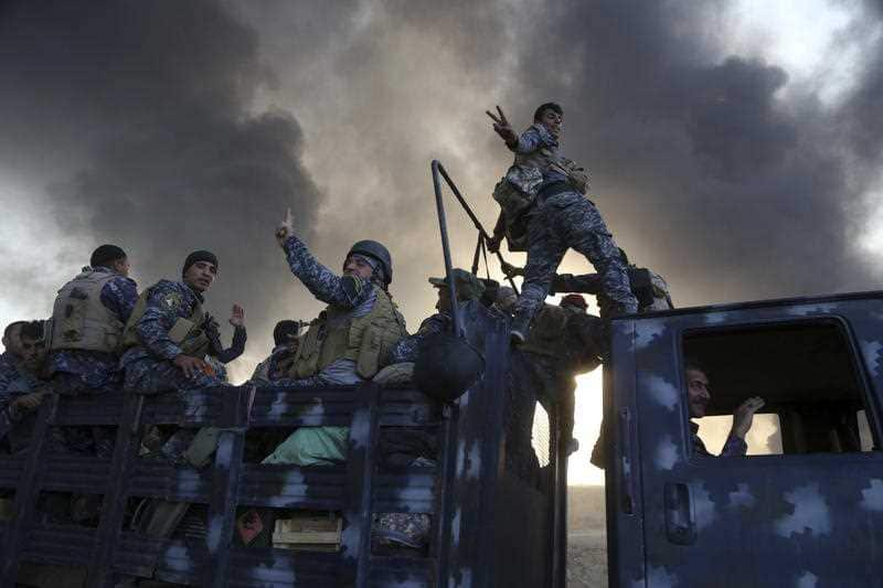 Smoke rises from Islamic state positions after an airstrike by coalition forces in Mosul, Iraq, Tuesday, Oct. 18, 2016. 